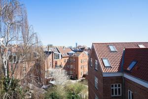 a view of a city with brick buildings at Beautiful 1-BR apartment in a fantastic location - 211 in Aarhus