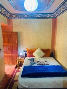 A bed or beds in a room at Gite Tawada