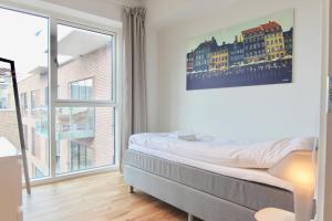 Кровать или кровати в номере Modern 2-bed wbalcony in Ørestaden