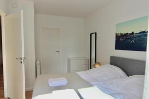 Ένα ή περισσότερα κρεβάτια σε δωμάτιο στο 2-BR apartment with a balcony in Ørestaden - 167 +4 φωτογραφίες