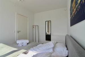 Ένα ή περισσότερα κρεβάτια σε δωμάτιο στο Stunning 2-BR with balcony fantastic views - 170