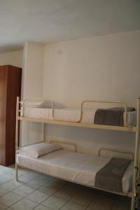 Ένα ή περισσότερα κρεβάτια σε δωμάτιο στο Casa Golloi