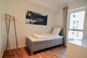Ένα ή περισσότερα κρεβάτια σε δωμάτιο στο 2-BR apartment with a balcony in Ørestaden - 166