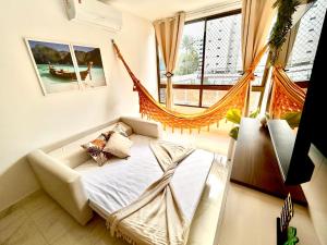 a bedroom with a hammock in a room at Flat Sand Beach-IntermaresPB in Cabedelo