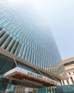 a tall building with a kaisala hotel at Assila, a Luxury Collection Hotel, Jeddah in Jeddah