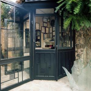 an entrance to a building with a green door at Assosyal Hotel in Behramkale