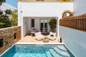 a pool in the backyard of a house at Sunday Luxury Suites in Agia Anna Naxos