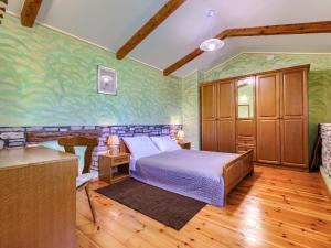 Łóżko lub łóżka w pokoju w obiekcie Holiday Home Narcis by Interhome
