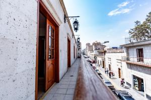 a view of an alley from a building with a door at Casona Terrace Hotel in Arequipa