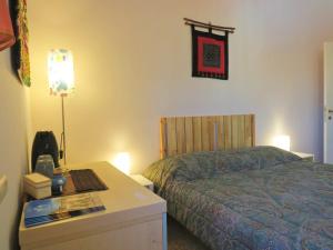 Postel nebo postele na pokoji v ubytování B&B CasaGiò