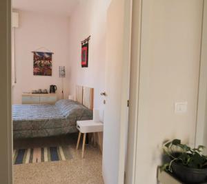 Postel nebo postele na pokoji v ubytování B&B CasaGiò