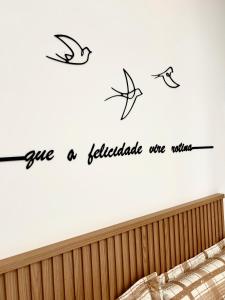 a wall sticker with aigraphy phrase give a reliable one wishes at Flat Sand Beach-IntermaresPB in Cabedelo +20 photos