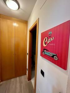 a room with a sign for a car on the wall at Plaza Mayor ATUAIRE in Burgos