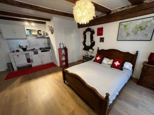 Postel nebo postele na pokoji v ubytování Grand studio hyper centre Neuchâtel