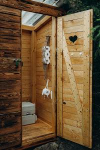 a wooden outhouse with a toilet in it at Glamping U Lesa in Rychnov nad Kněžnou