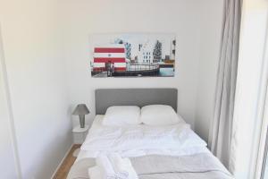 Postel nebo postele na pokoji v ubytování Great 1-bed w balcony by Odense Harbour