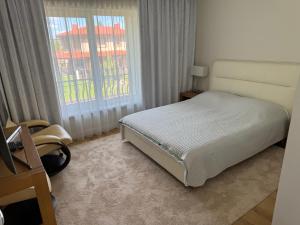 מיטה או מיטות בחדר ב-LightHouse Riese