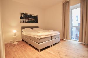 Кровать или кровати в номере Great 3-bed wbalcony in Ørestaden