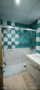 a bathroom with a shower and a sink at El Faro de Canet in Canet de Berenguer