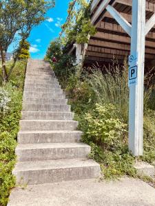 a set of concrete stairs next to a building at Sweet home 74 in Frangy +3 photos