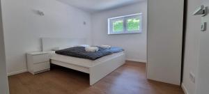 Voodi või voodid majutusasutuse Naia Apartments toas
