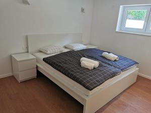 Voodi või voodid majutusasutuse Naia Apartments toas