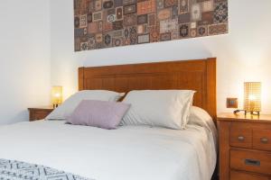 Postel nebo postele na pokoji v ubytování Home2Book Cozy Apt 2 Min From La Garita Beach