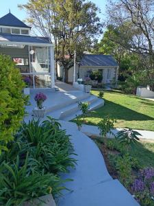 a walkway in front of a house at Sandton Spring Rivonia in Johannesburg +97 photos