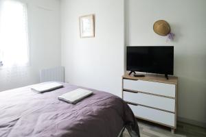 Кровать или кровати в номере Joli appartement aux Sables dOlonne - 4 pers