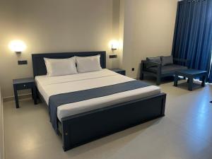 Postel nebo postele na pokoji v ubytování Grand Ben Hotel