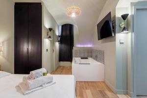a hotel room with a bed and a sink at Suite Romantique Balnéo Centre Lyon in Lyon