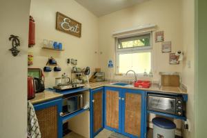 Kuchyň nebo kuchyňský kout v ubytování Trois Piton Apartments