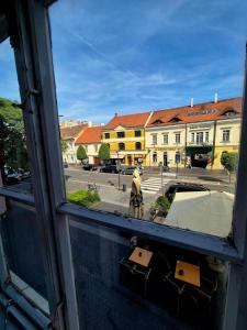 a view of a street from a window at Old city apartment in Sopron +1 photo