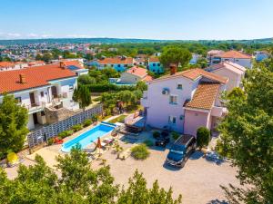 an aerial view of a house with a swimming pool at Villa Laura in Vantačići
