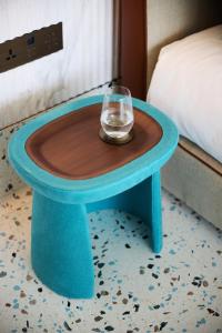a blue table with a glass on top of it at Nammos Hotel Mykonos in Psarou