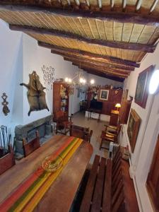 a dining room with a table and a fireplace at La Arcadia in Tafí del Valle
