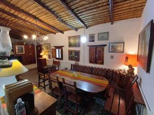 a dining room with a table and chairs at La Arcadia in Tafí del Valle +32 photos