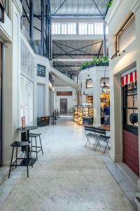 a room with tables and chairs in a building at FsN Central Lofts 303 /2bed / 5P in Thessaloniki