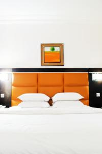 Postel nebo postele na pokoji v ubytování Cata Apartment Hotel And Spa