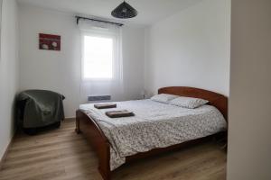 Posteľ alebo postele v izbe v ubytovaní Appartement dans résidence au calme avec piscine