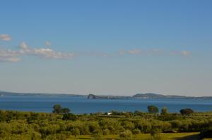 a view of a body of water with the horizon at La Fraschetta in Bolsena