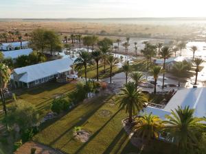 an aerial view of a resort with palm trees at Flying Ostrich Guesthouse & Self-catering Accommodation in Mariental