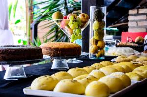 a table with cakes and other desserts on display at Marilyn Café in Morro de São Paulo