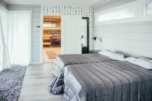 Katil atau katil-katil dalam bilik di SleepWell Villa Hartola