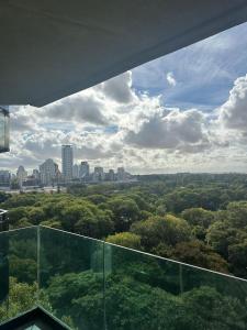 a view of a city skyline from a glass building at Mansión Botánico Luxury Buenos Aires in Buenos Aires +3 photos