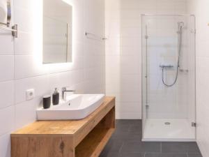 a bathroom with a sink and a shower at Apartment be home by Interhome in Mieming