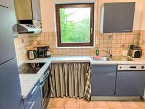 a small kitchen with a sink and a window at Apartment Kersten by Interhome in Essen