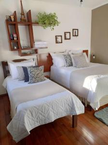 Hospedaria Canto do Vinhedo客房内的一张或多张床位