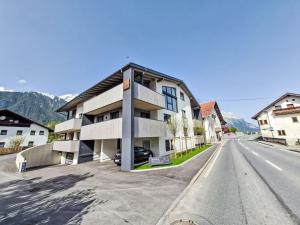 an apartment building on the side of a street at Apartment be magic by Interhome in Mieming