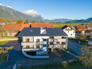 an aerial view of a house with mountains in the background at Apartment be calm by Interhome in Mieming